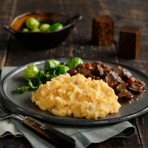 Image of cooked and plated Idahoan® Smokey Cheese & Bacon Mashed Potatoes