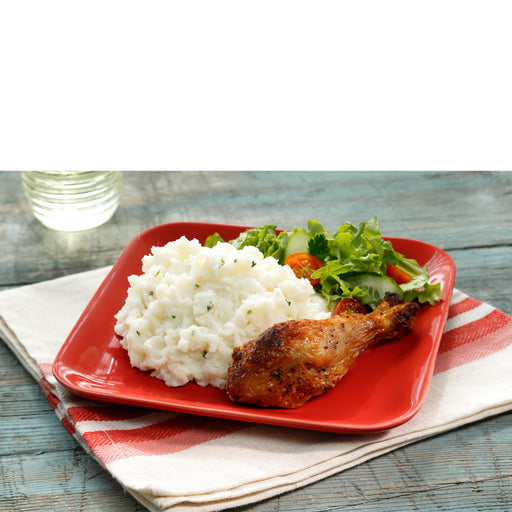 Idahoan® Sour Cream & Chives Mashed made on a plate with chicken