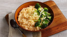Idahoan® Four Cheese Mashed Potatoes made on a plate with broccoli