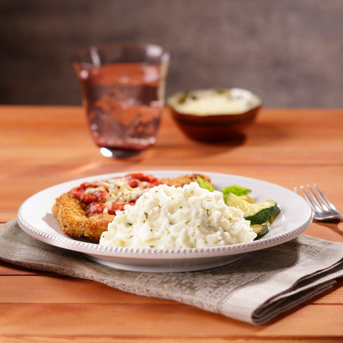 Image of cooked and plated Idahoan® Baby Reds® w/Roasted Garlic & Parm Mashed Potatoes