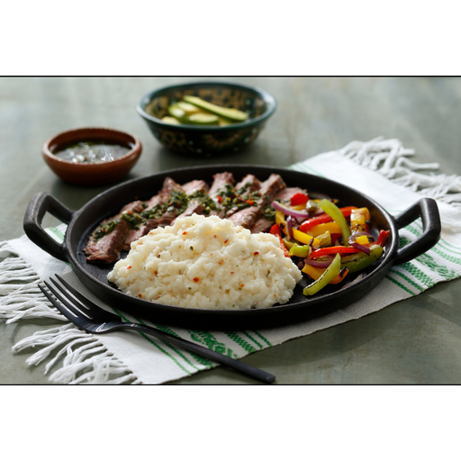 Image of cooked and plated Idahoan® Monterey Pepper Jack Mashed Potatoes