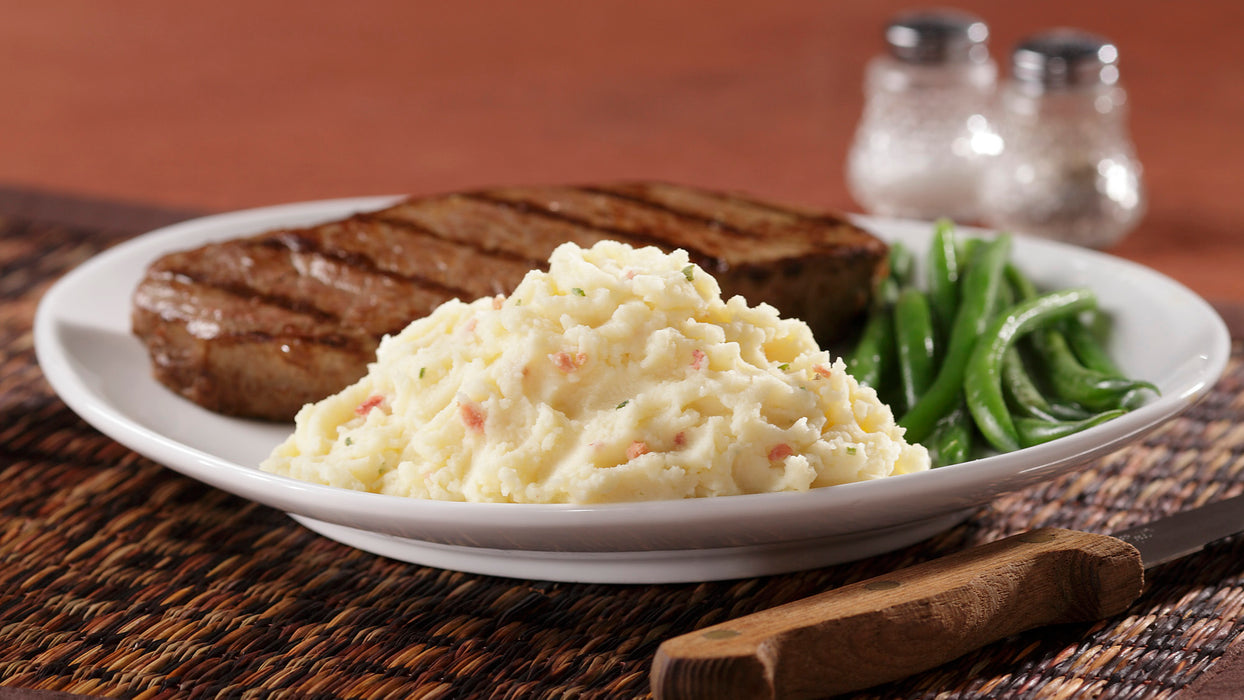 Idahoan Loaded Baked® Mashed Potatoes Family Size made on a plate